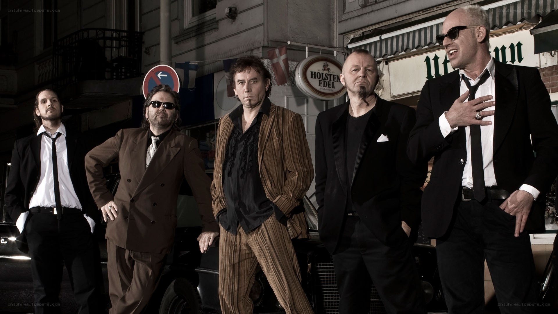 band posing on street