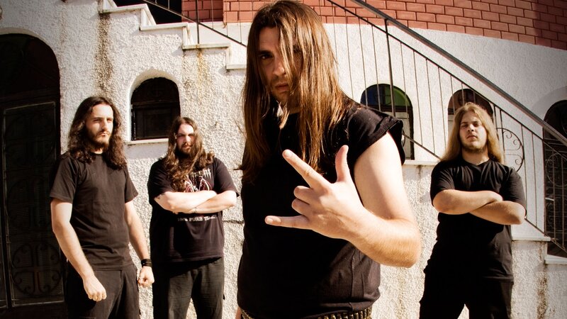 band posing outside building