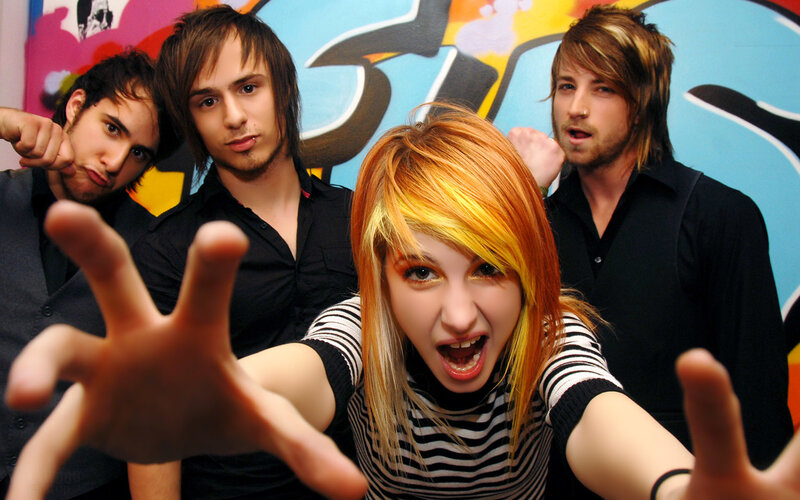 band posing with energetic expressions