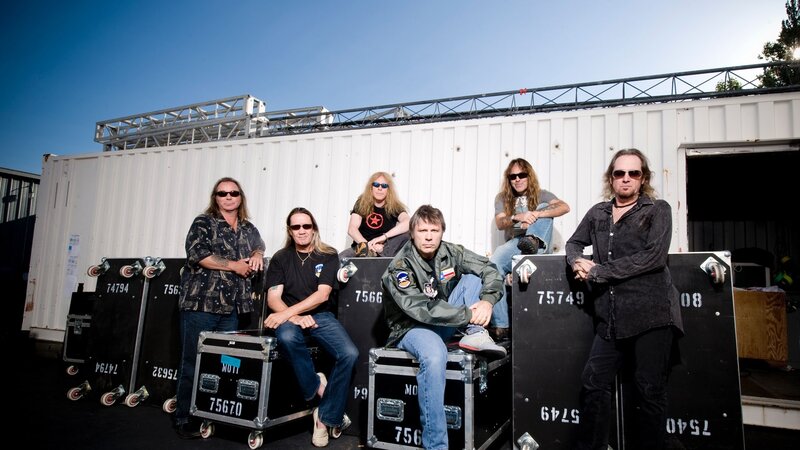 band posing with equipment