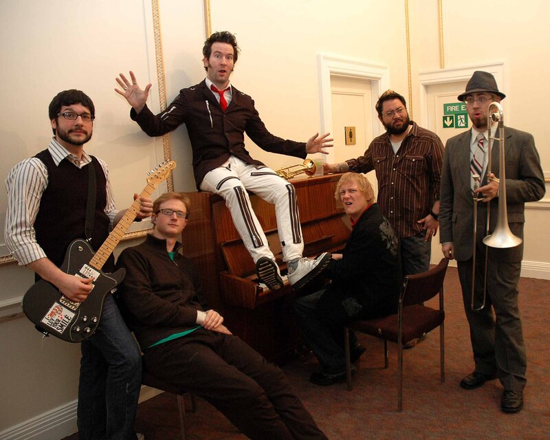 band posing with instruments