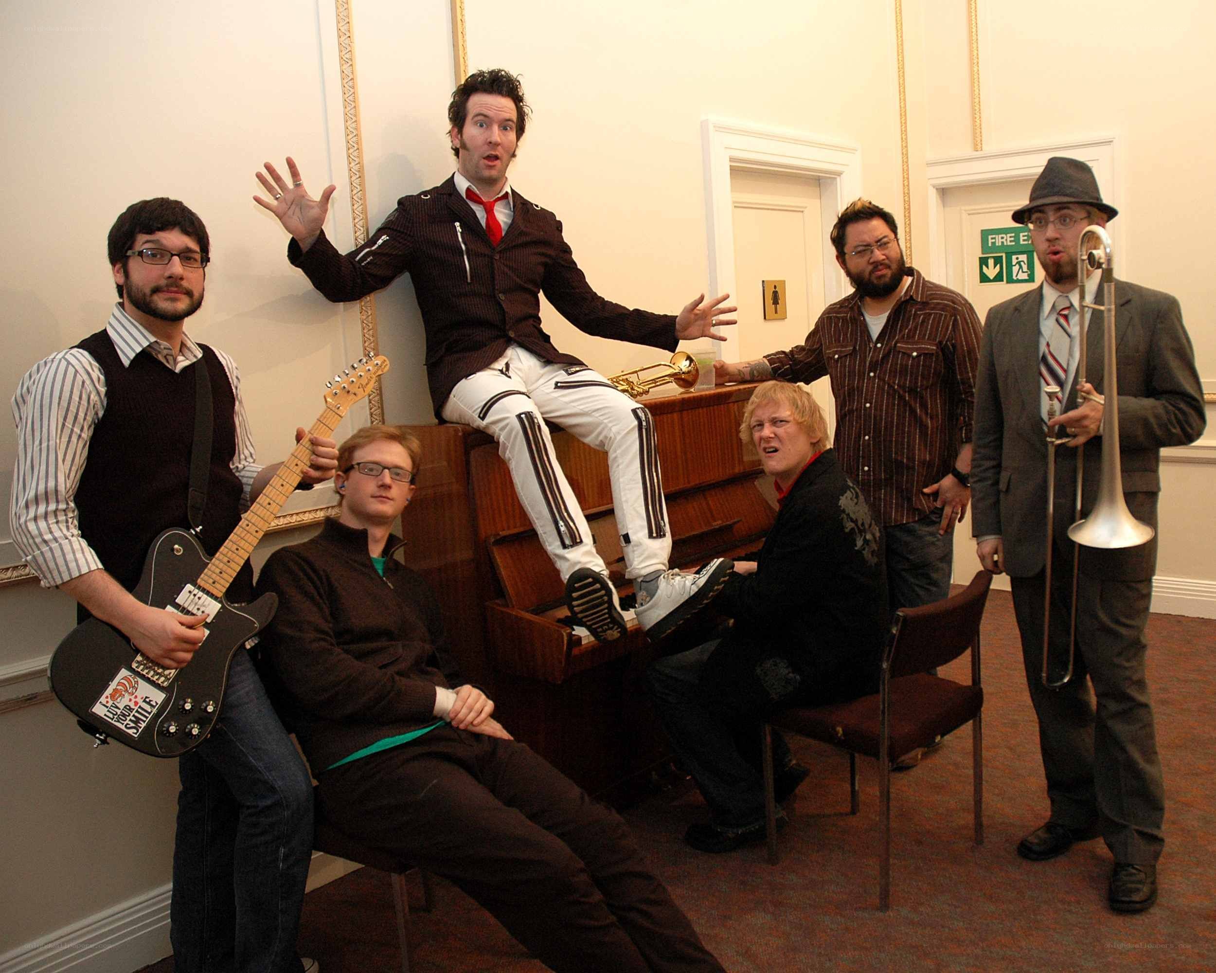 band posing with instruments