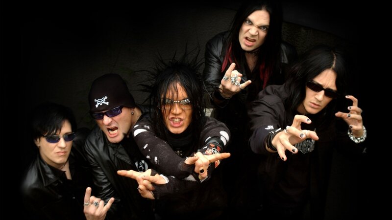 band posing with rock gestures