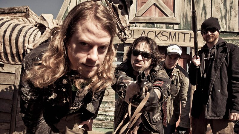 band posing with weapons