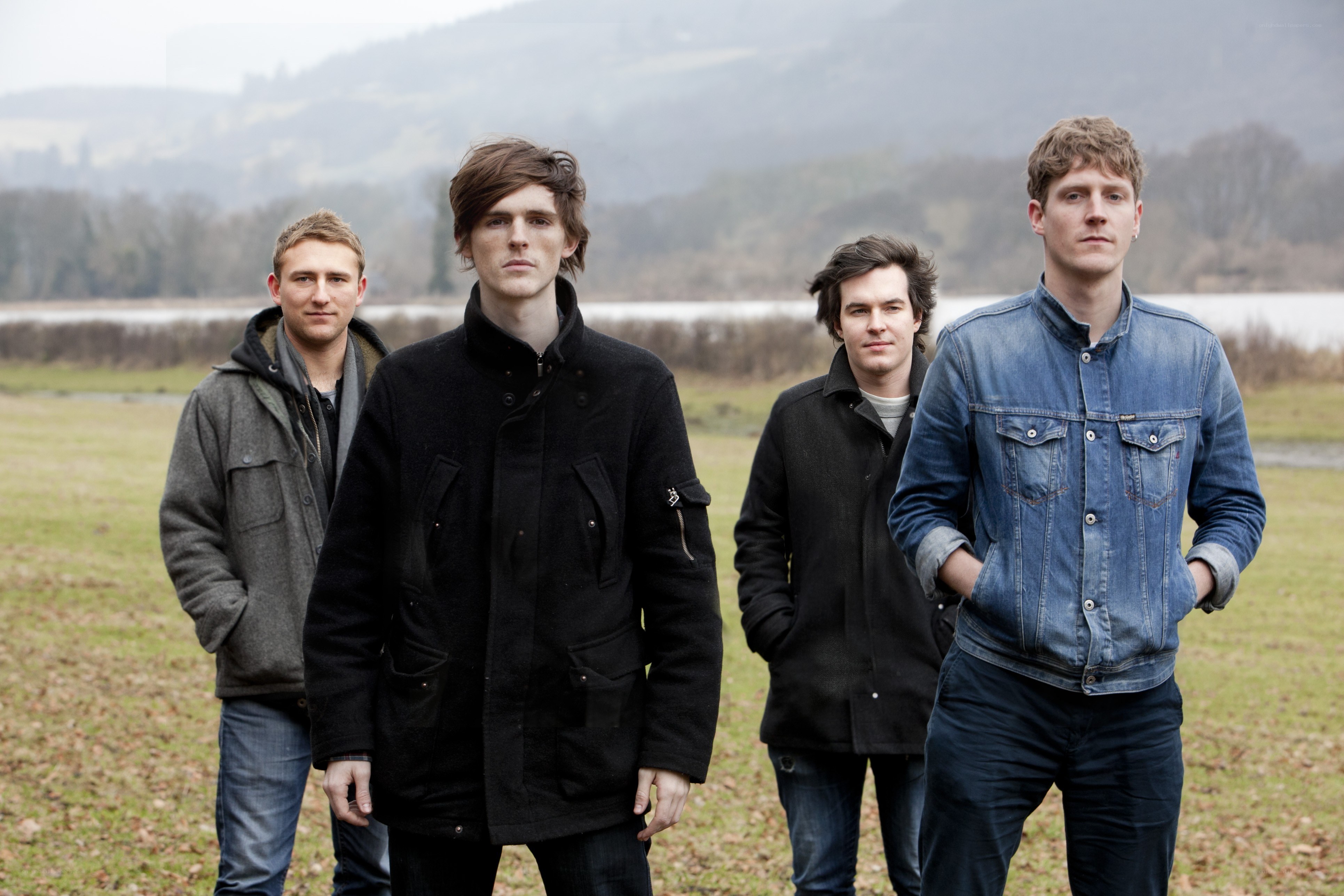 band standing in a field