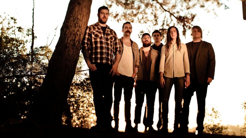 band standing in forest