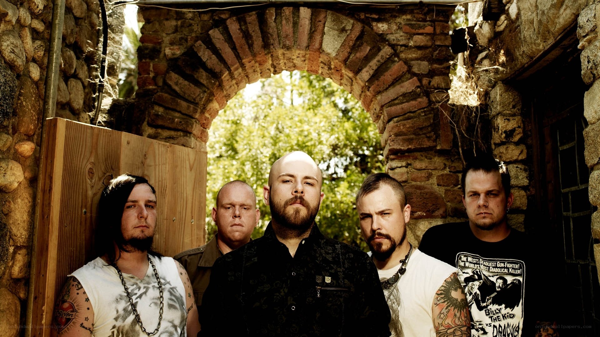 band standing in stone archway