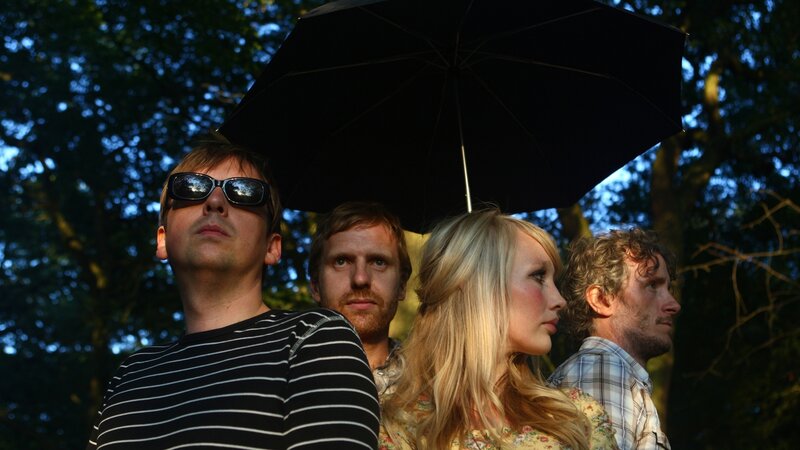 band under umbrella in park