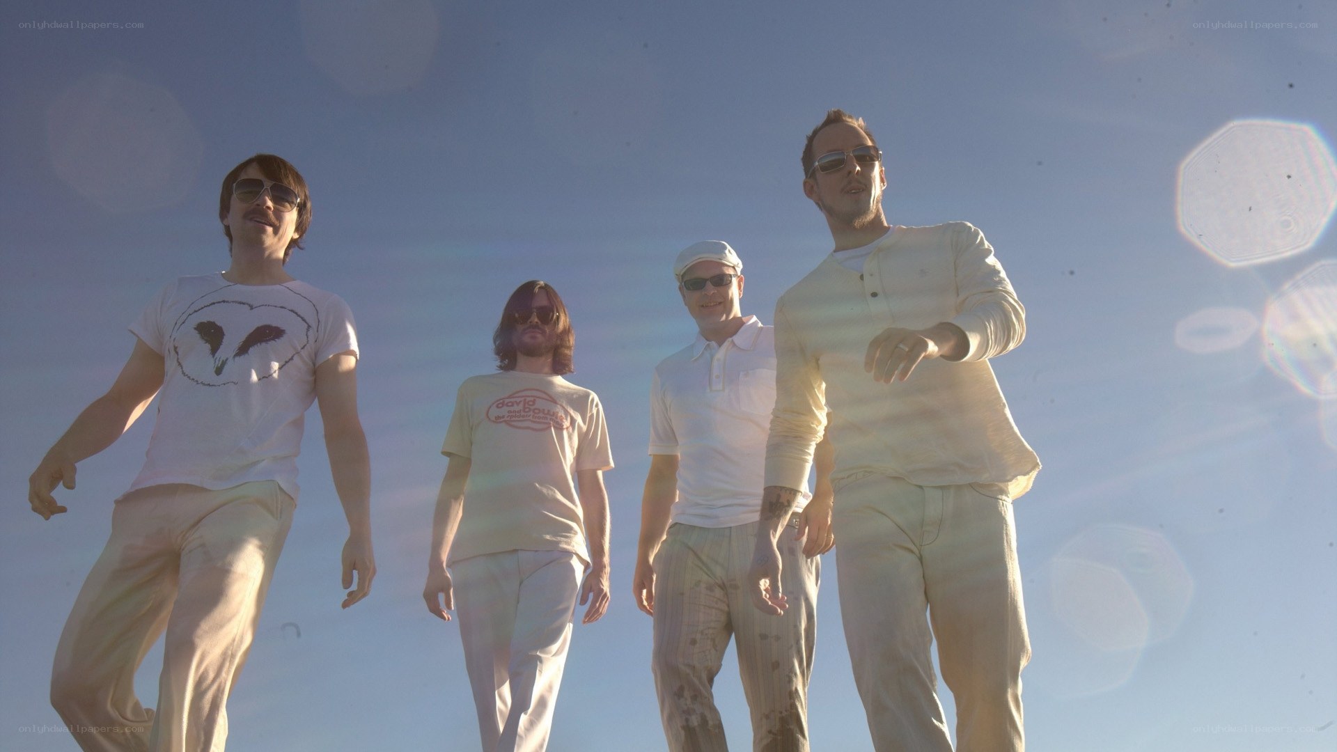 band walking in sunlight