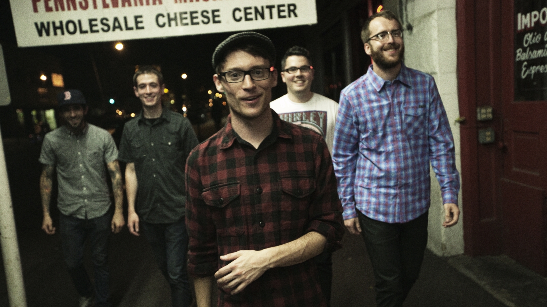 band walking on street at night