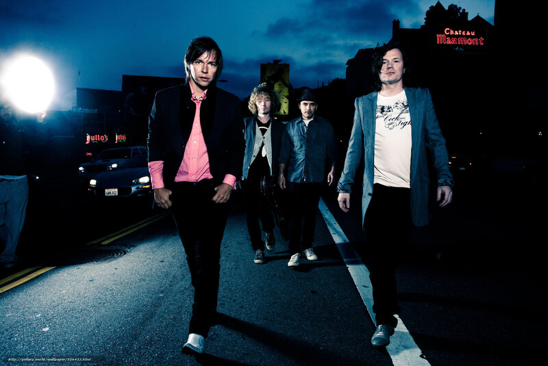 Band Walking on Street — Blue
