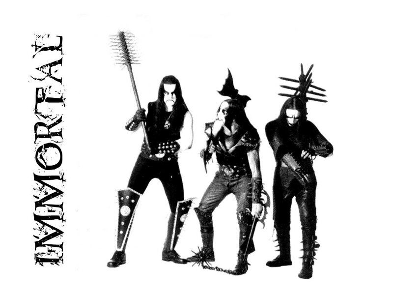 band with dark costumes and props