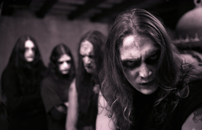 band with dark makeup and long hair