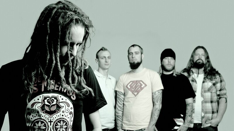 band with dreadlocks and tattoos