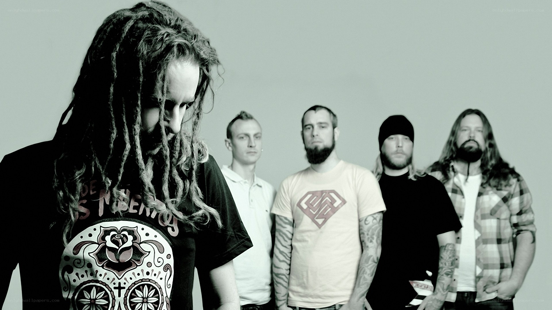 band with dreadlocks and tattoos