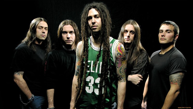 band with dreadlocks in green jersey