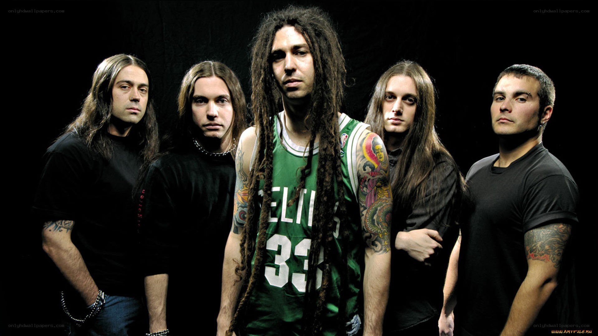 band with dreadlocks in green jersey