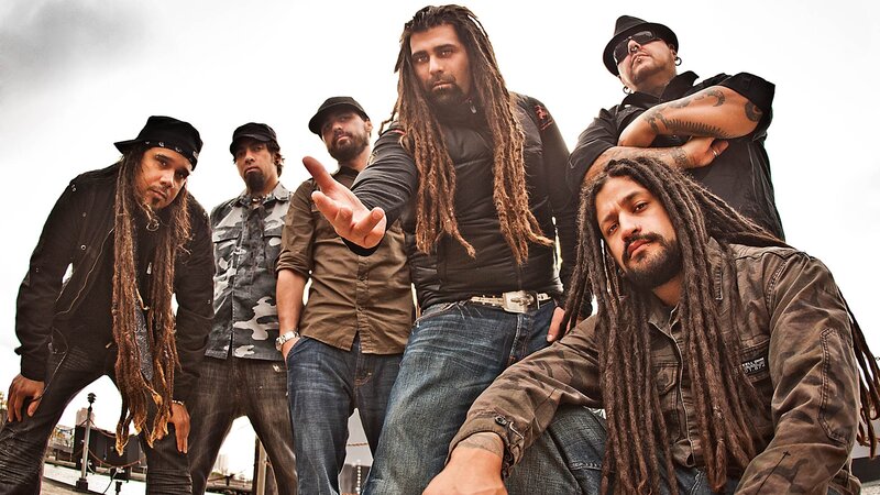 band with dreadlocks posing