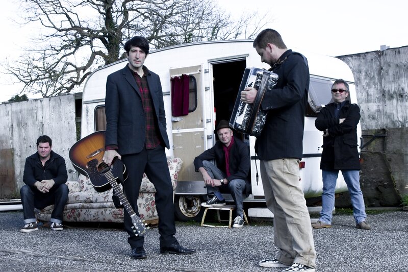 band with instruments outside trailer