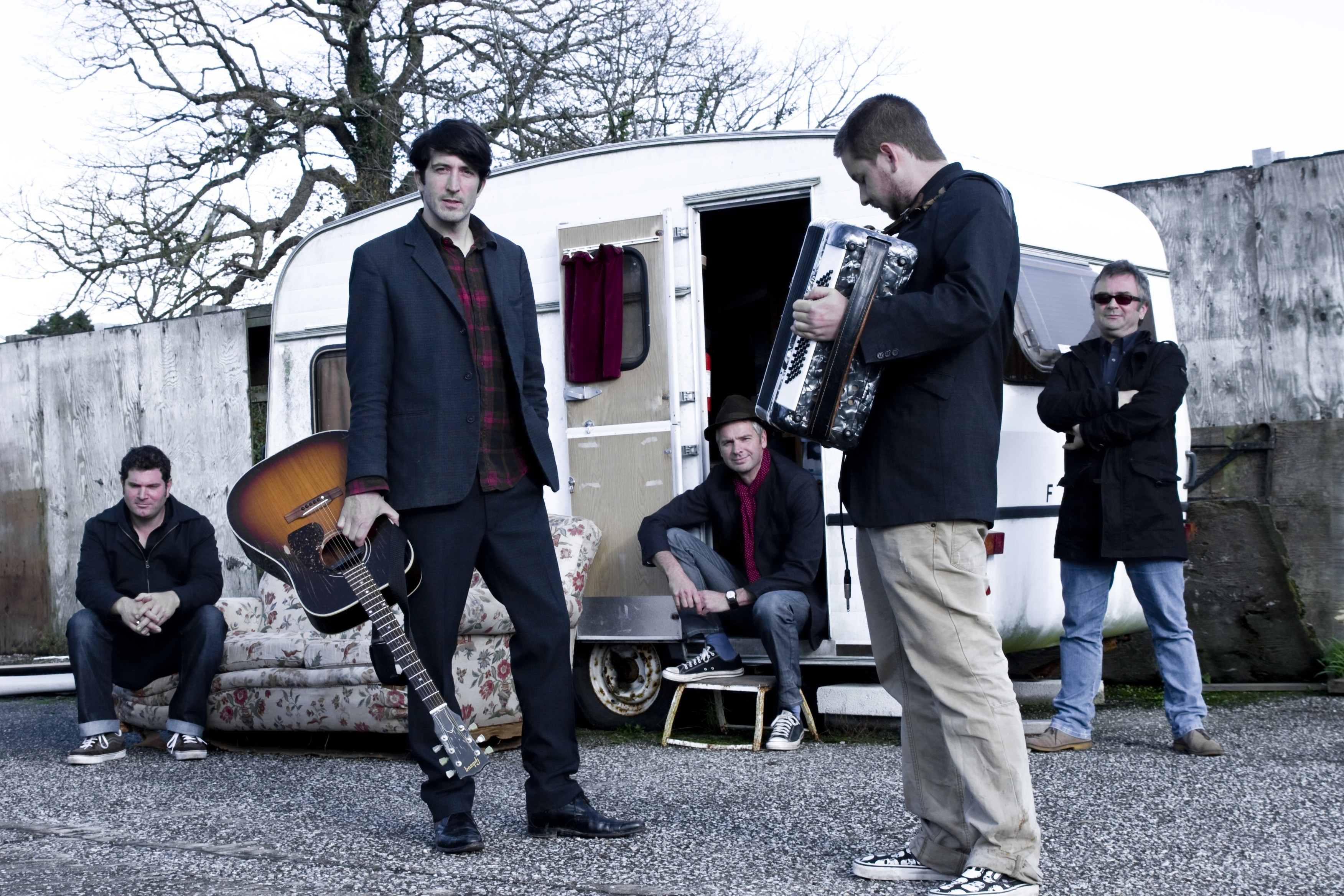 band with instruments outside trailer