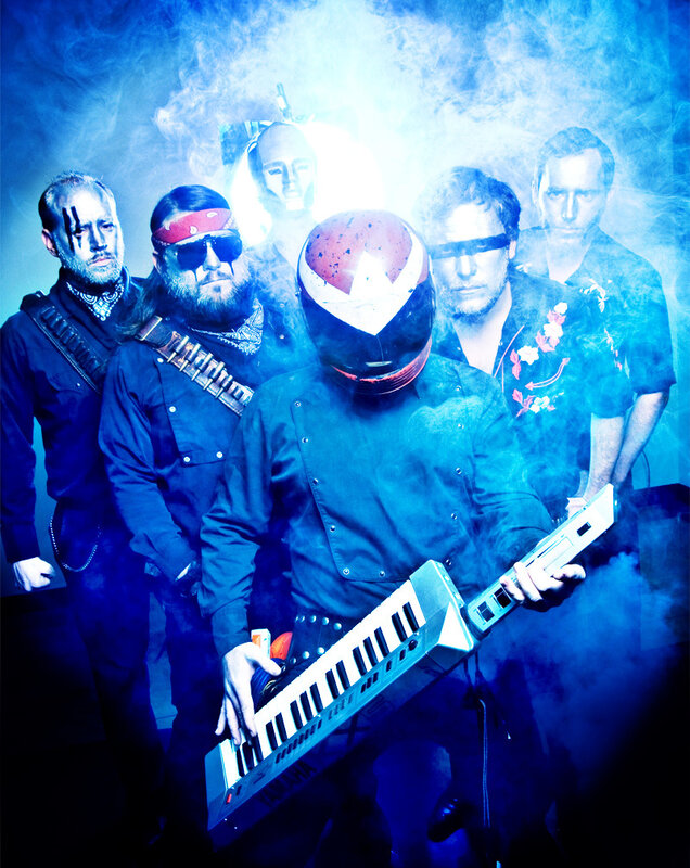 band with keyboardist in helmet