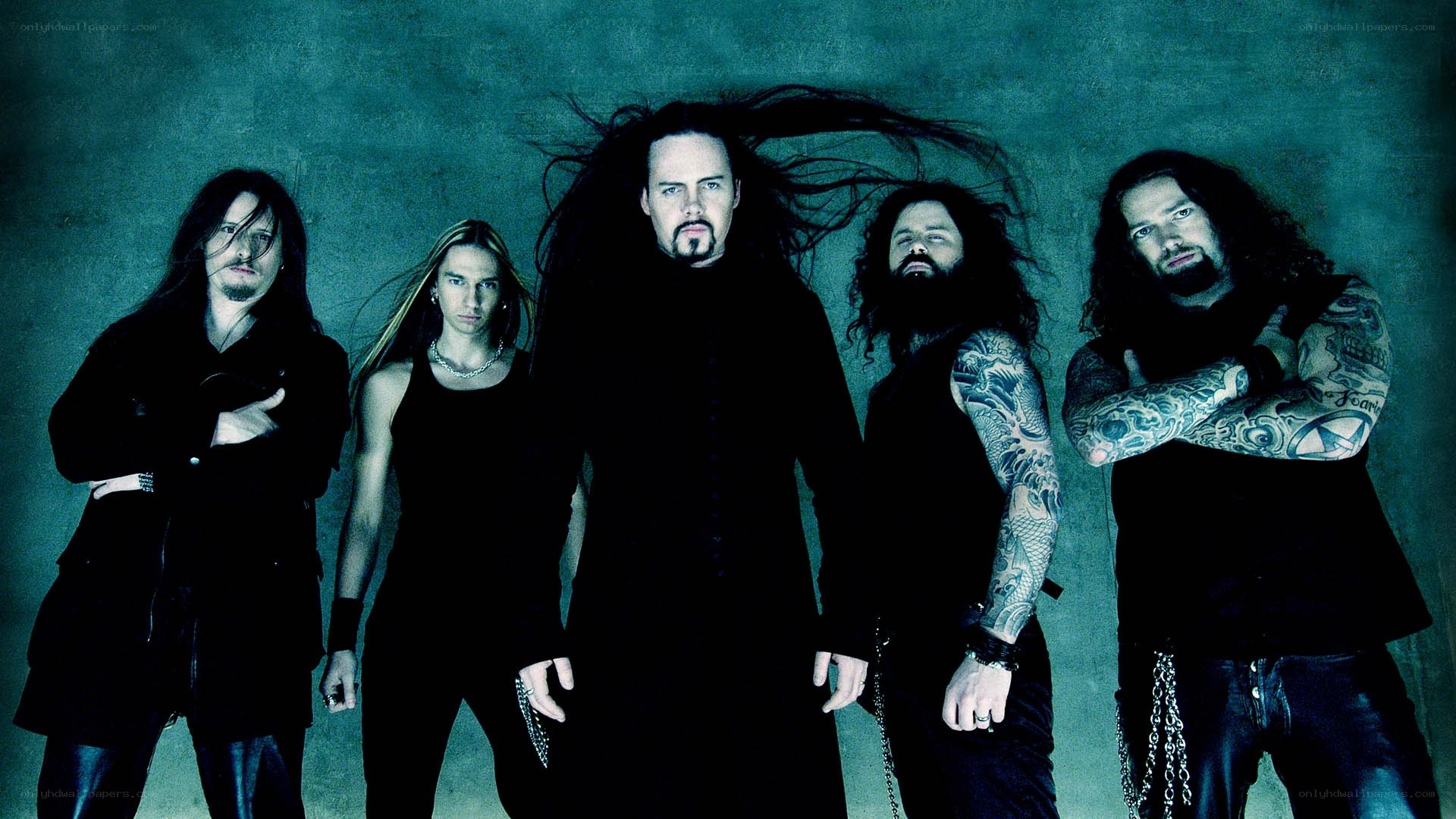 band with long hair and tattoos