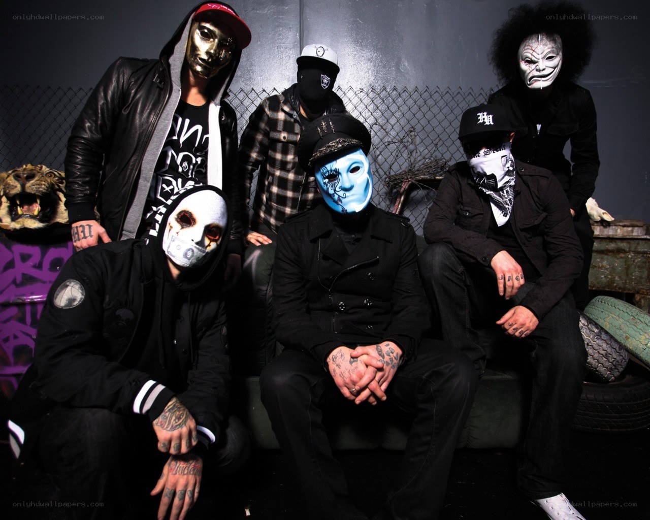 band with masks and tattoos