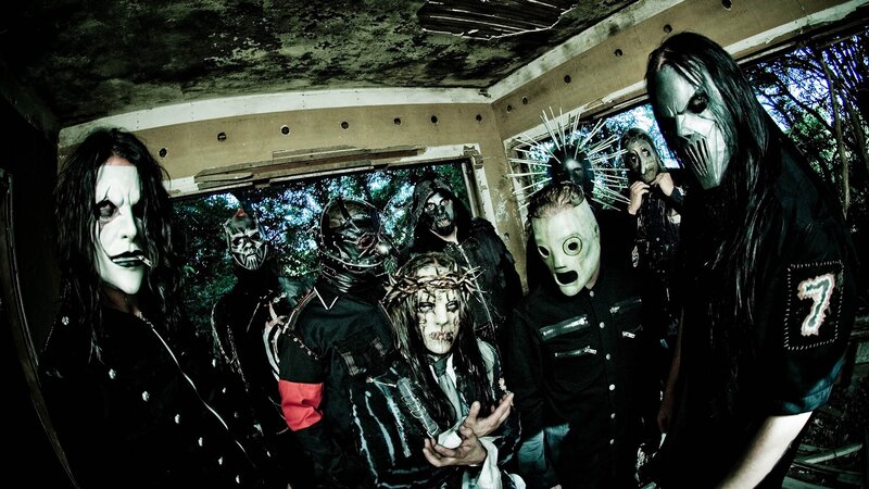 band with masks in abandoned building