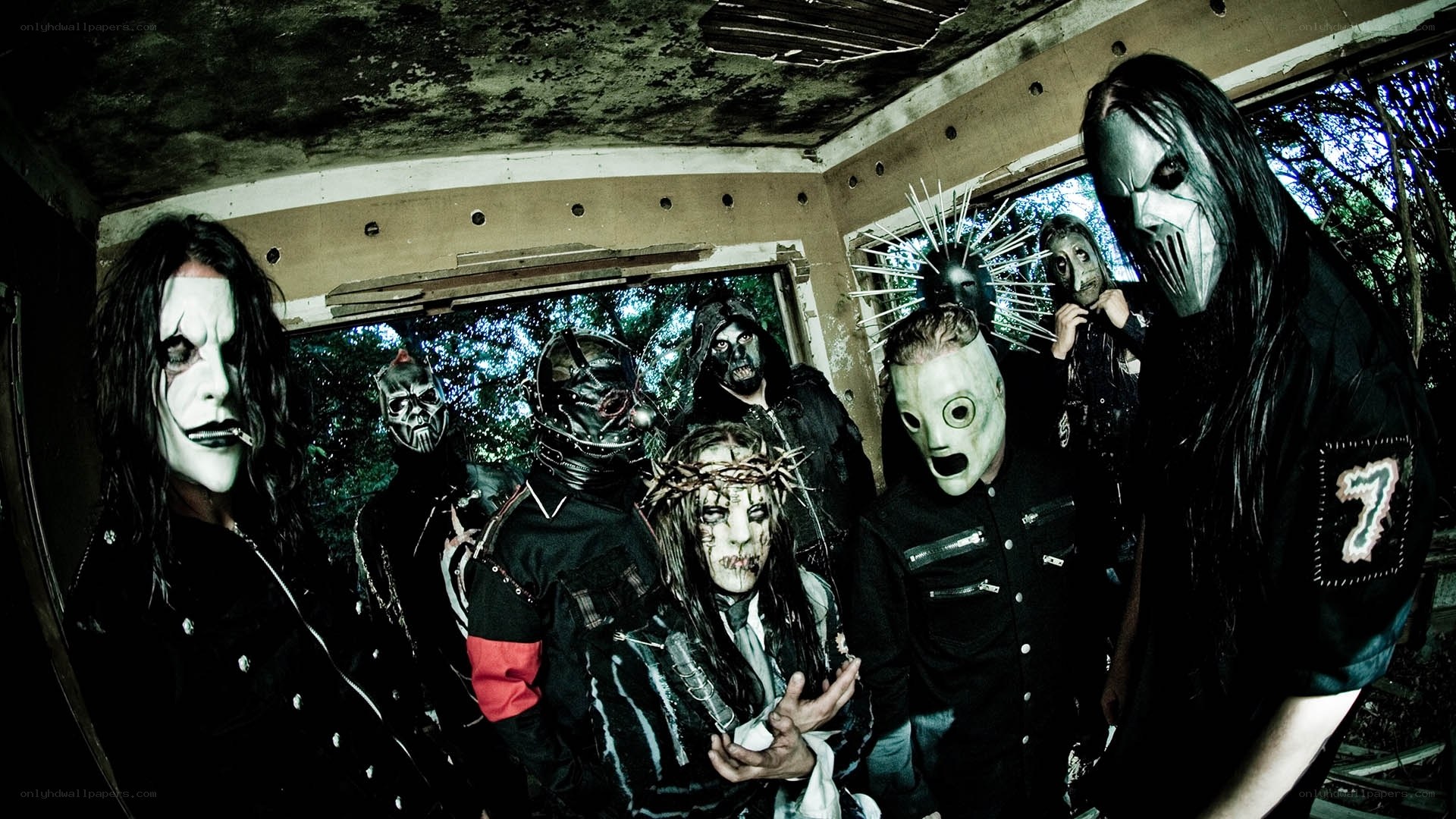 band with masks in abandoned building