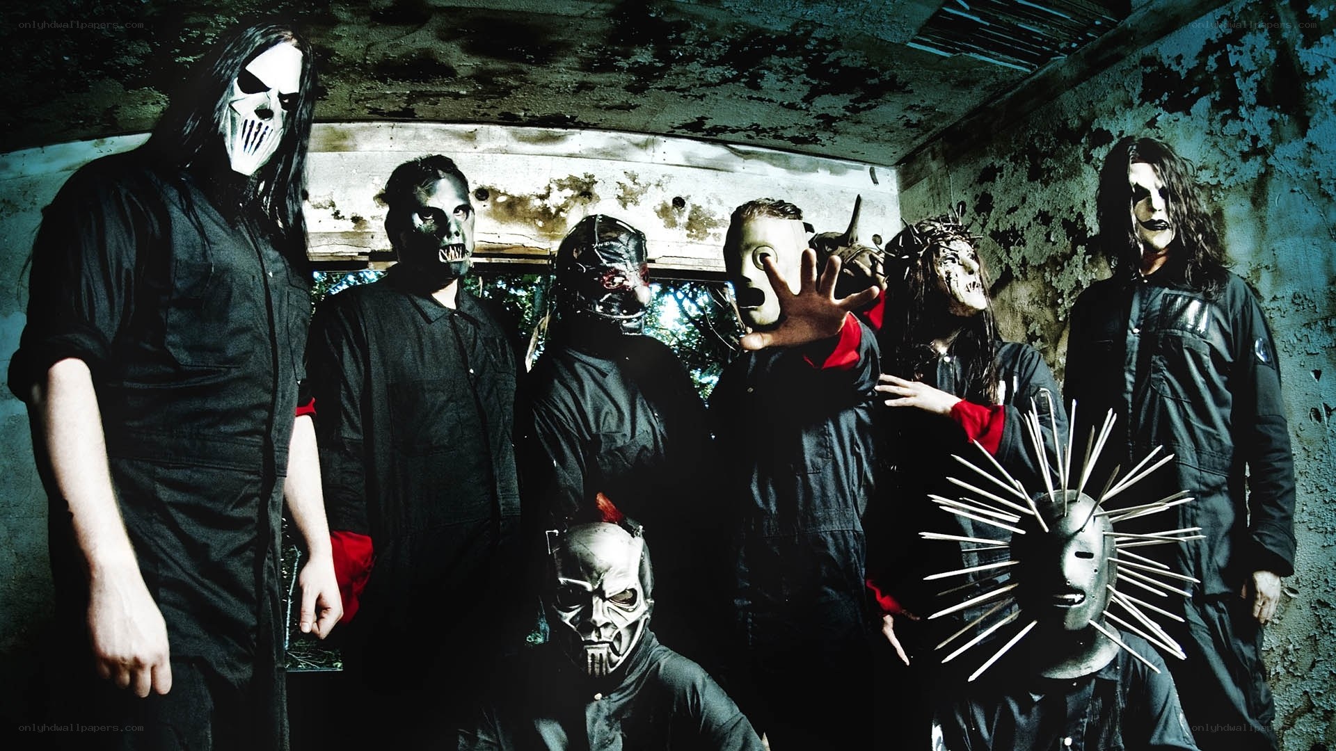 band with masks in dark room