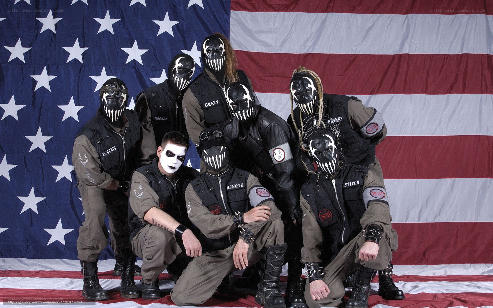 band with masks in front of flag