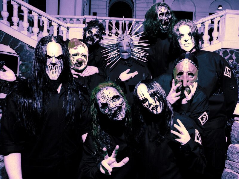 band with masks on stairs