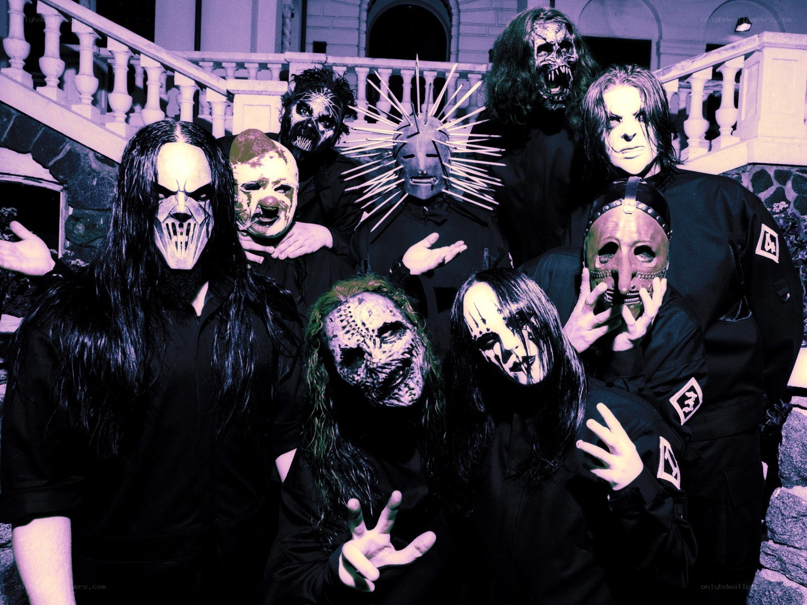 band with masks on stairs