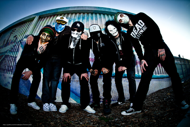 band with masks posing