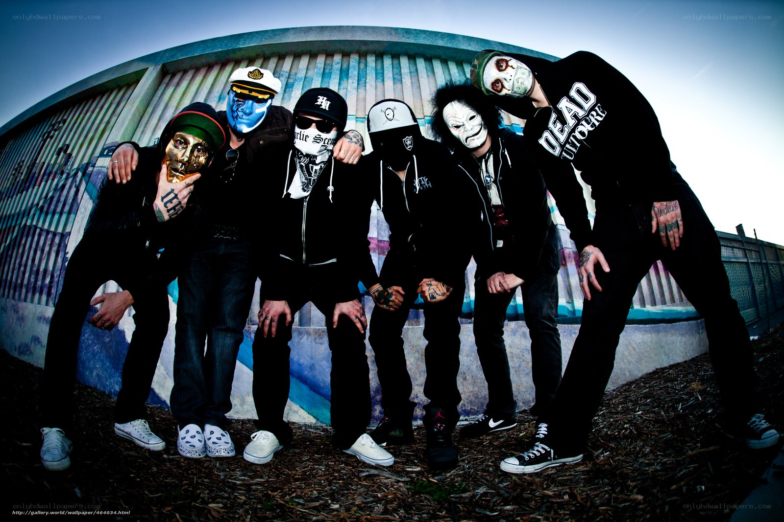 band with masks posing