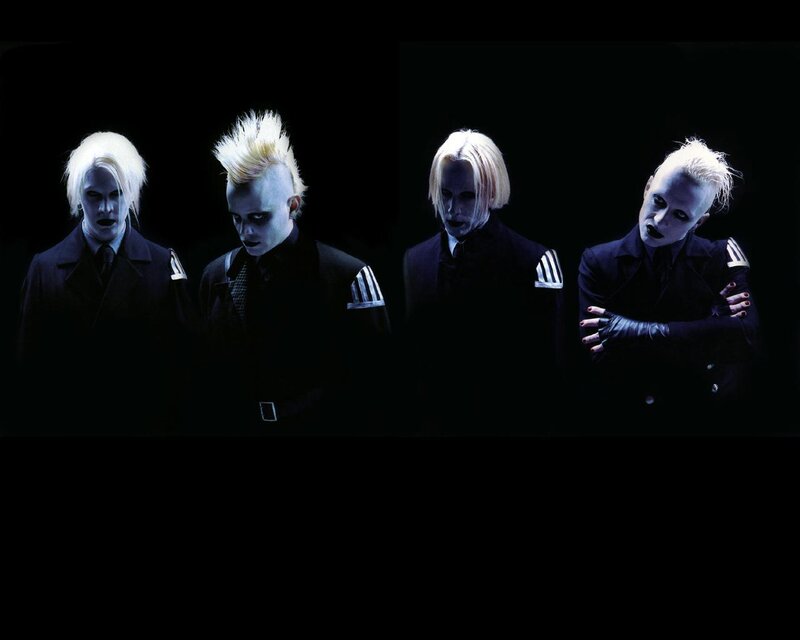 band with pale makeup and white hair