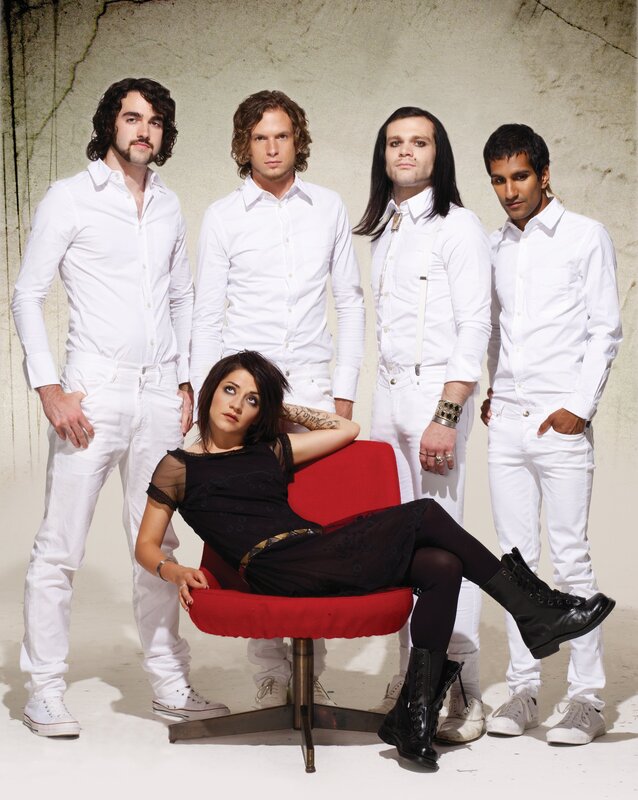 band with singer in red chair