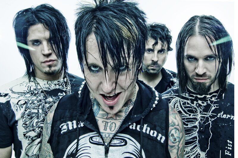 band with tattoos and dark hair