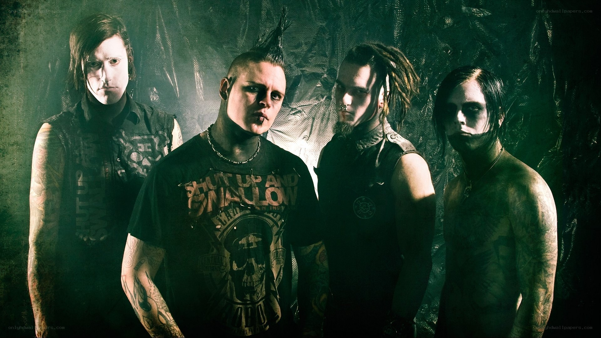 band with tattoos and makeup