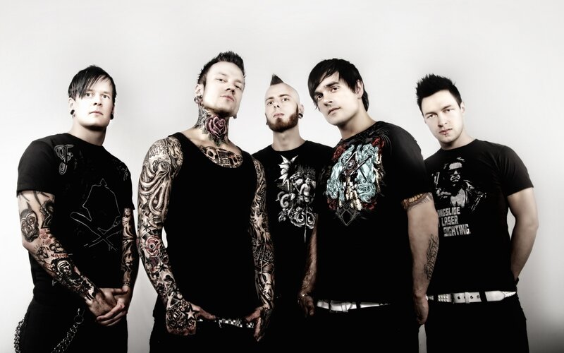 band with tattoos and piercings