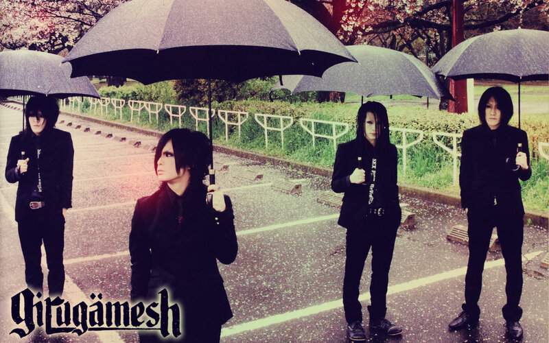 band with umbrellas in rain