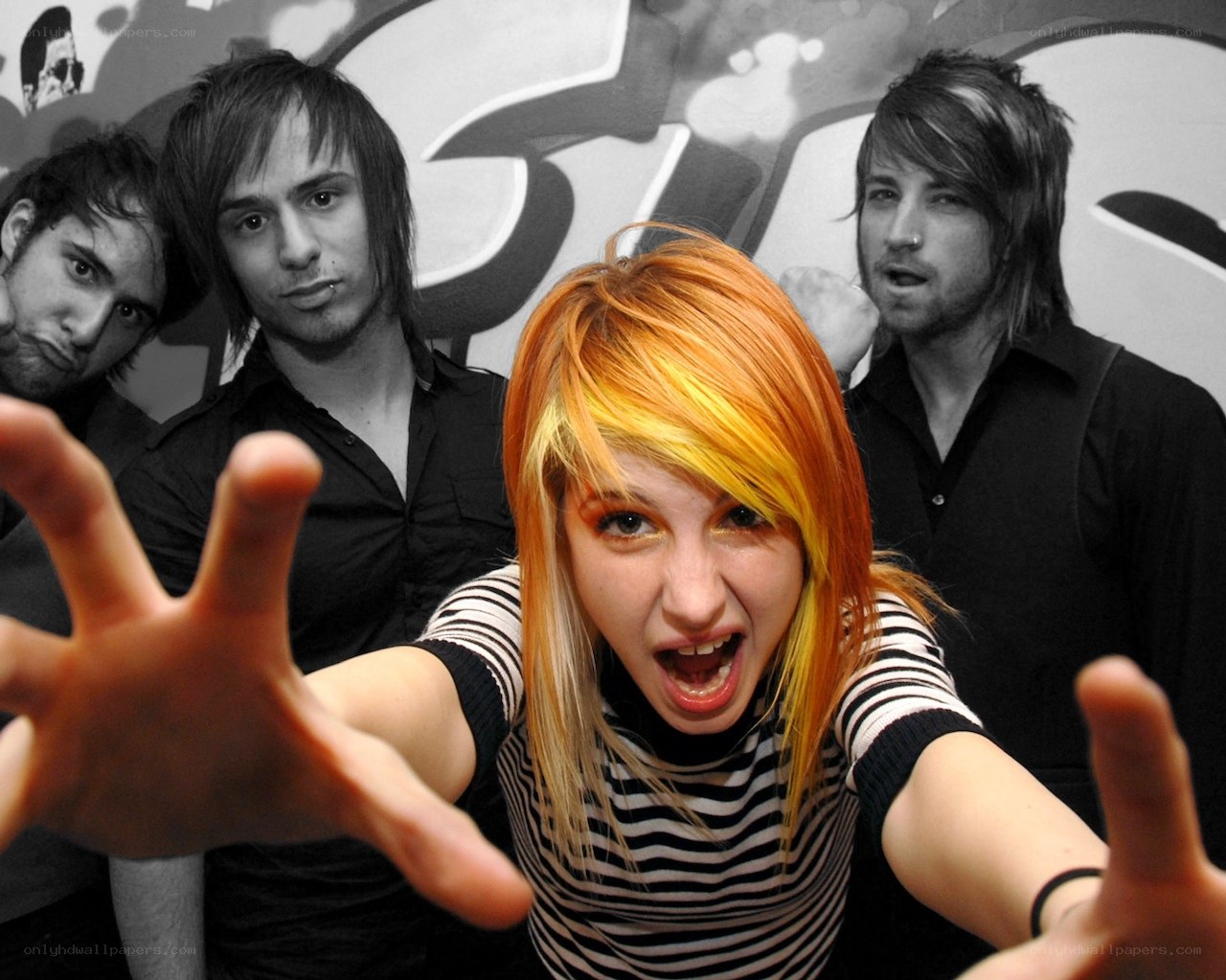 band with vibrant hair posing