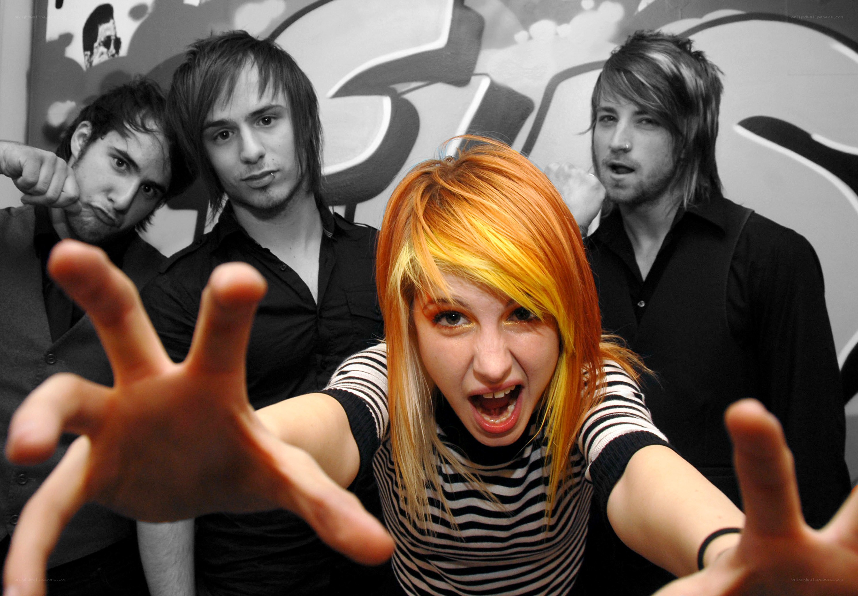 band with vibrant hair posing