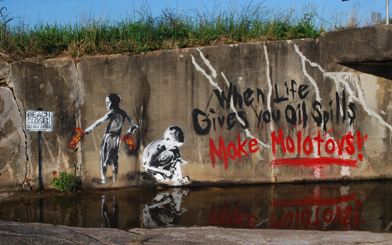 Banksy graffiti on concrete wall
