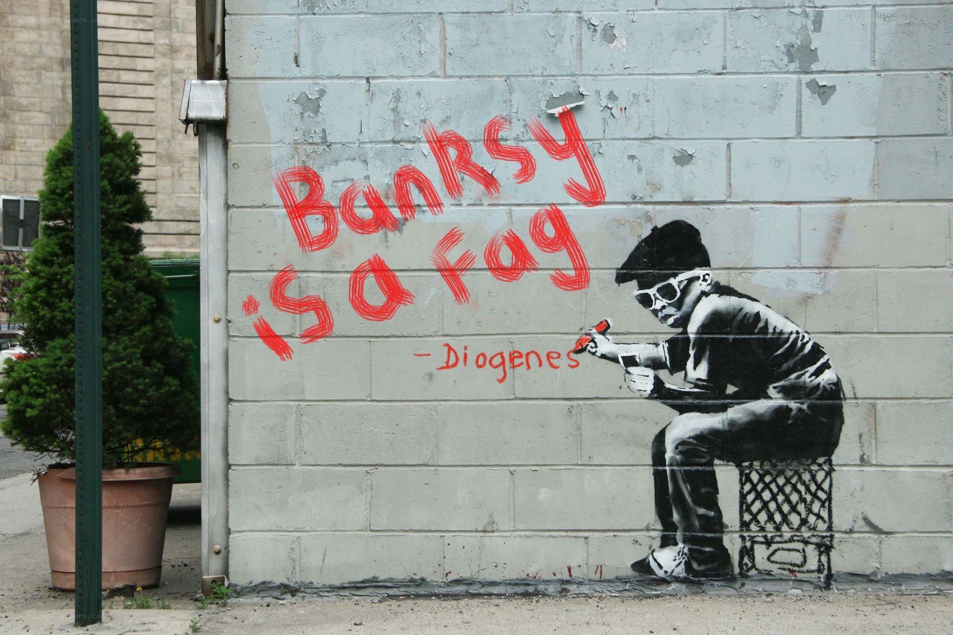 Banksy graffiti with red text