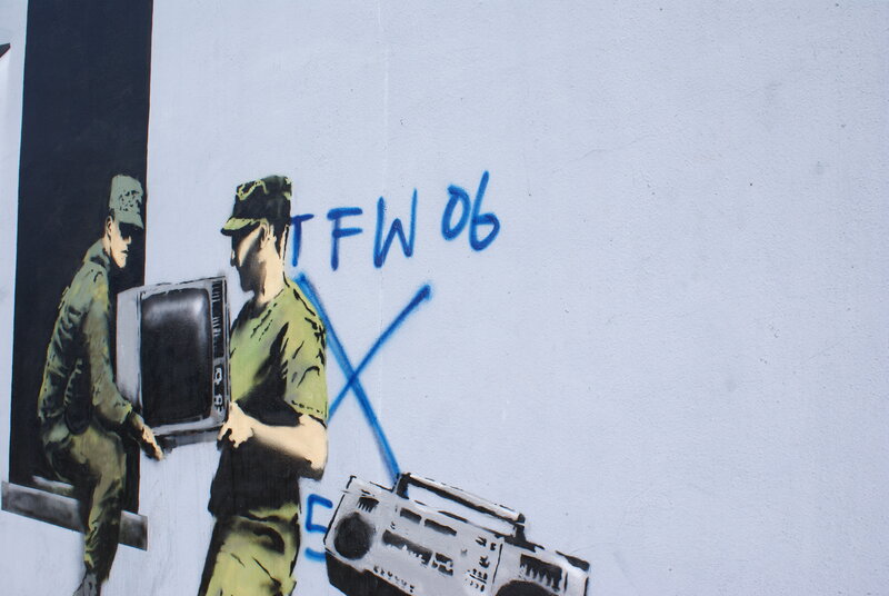 Banksy mural with soldiers