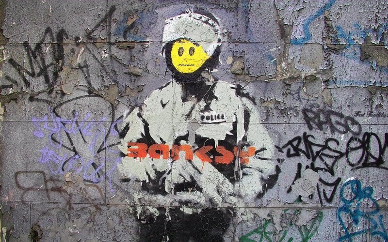 Banksy police officer graffiti