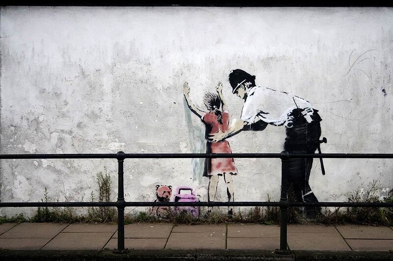 Banksy's Police and Girl Graffiti