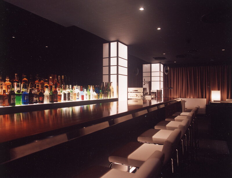 Bar with Bottles and Stools