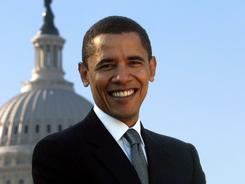 Barack Obama smiling in front of Capitol